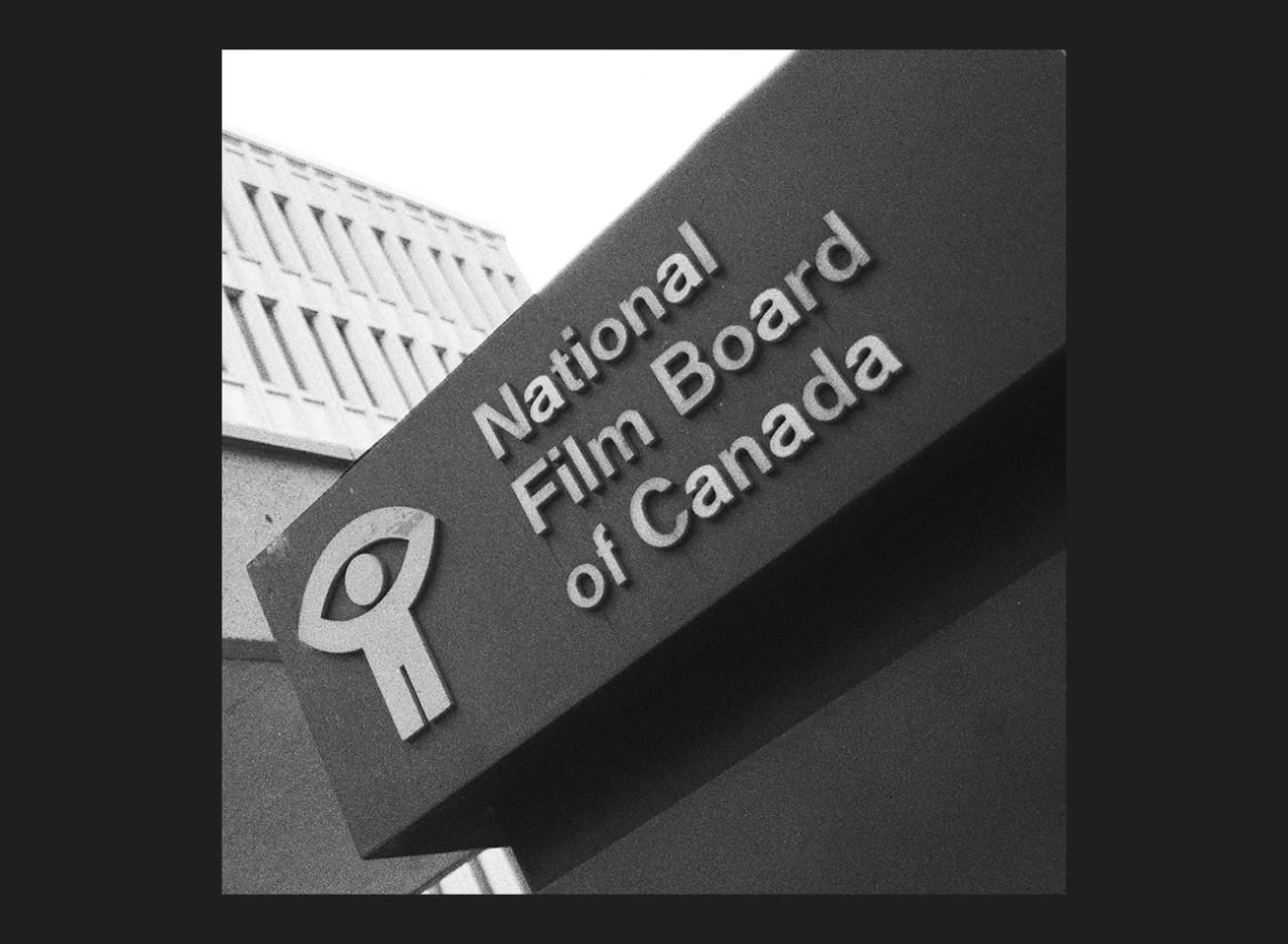 Black-and-white photograph of a National Film Board of Canada sign with the NFB symbol