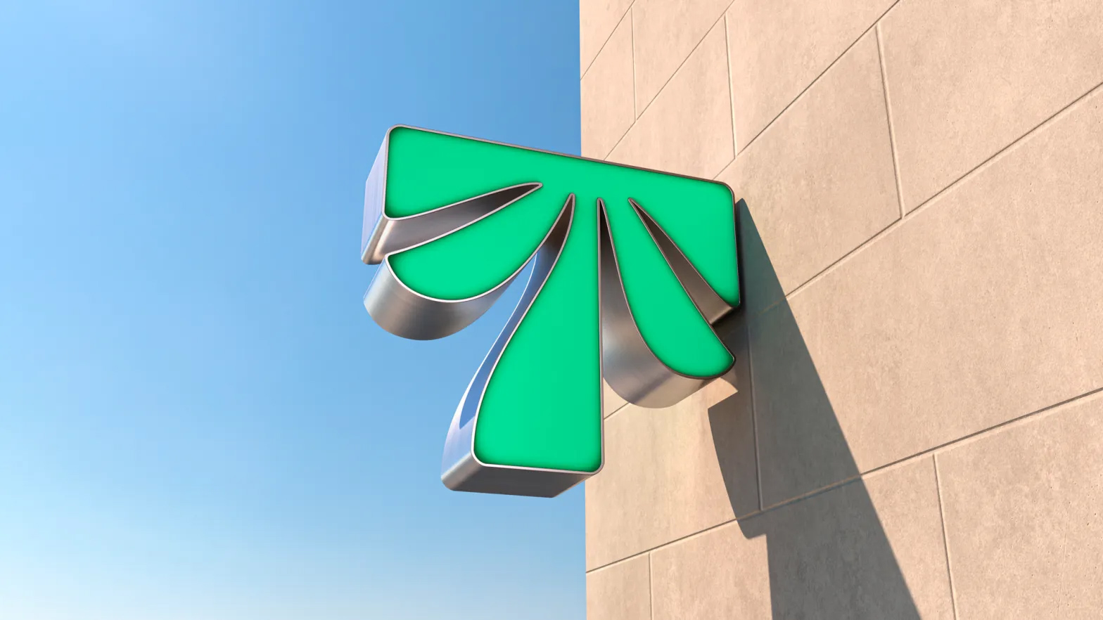 Green dimensional Tropical Smoothie Cafe sign combining a capital T and a palm tree on a building